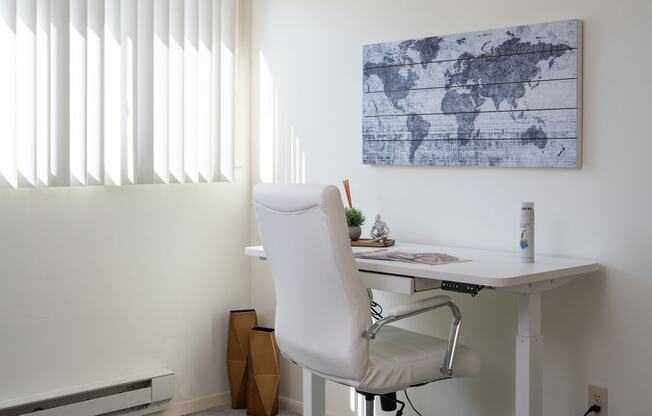 a desk with a chair in a home office