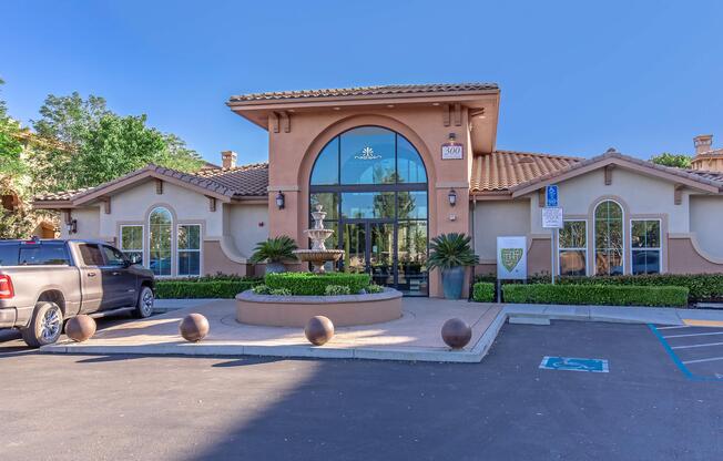 a small house in a parking lot with Paramount Pictures in the background