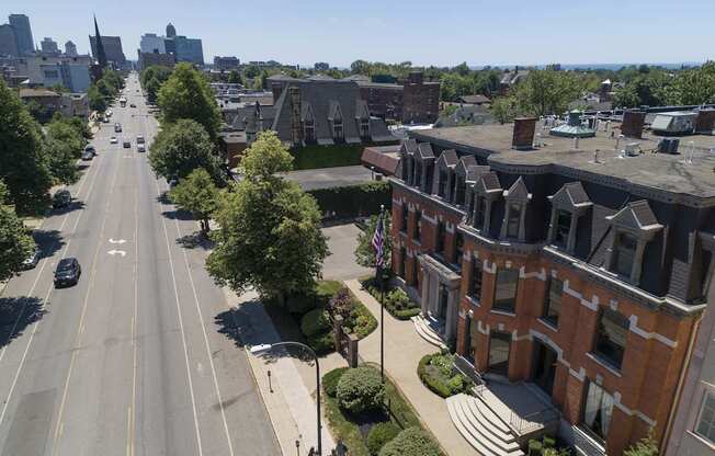 an aerial view of a city street and houses at The Knights @ 506 Delaware Apartments, Buffalo, NY 14202