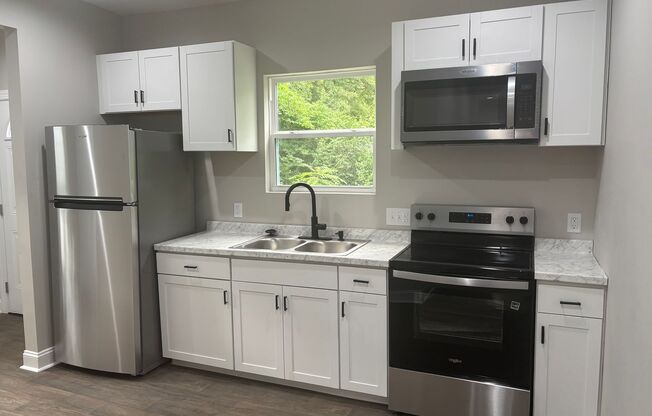 3 Bedroom 1 Bath Fully Renovated House- Lawn Care Included!