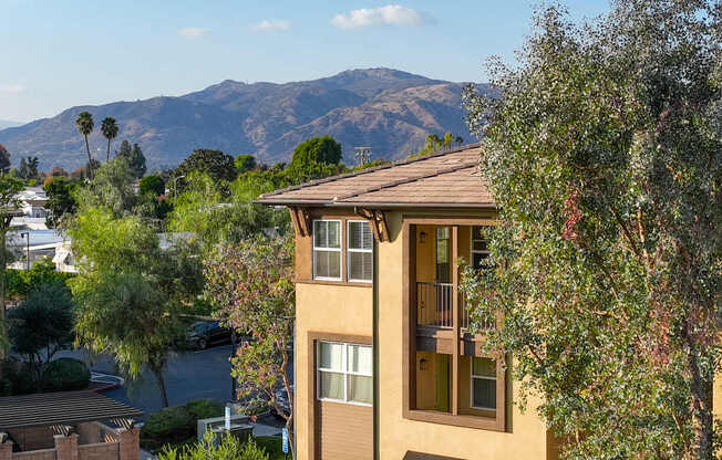 A building with a mountain in the background.