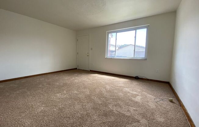 Cozy Two Bedroom Townhome with Central AC & Off-Street Parking! Call Today to Schedule a Tour!