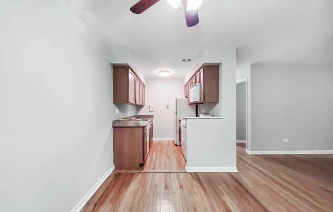 a kitchen and dining area in a 555 waverly unit