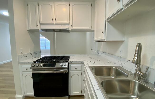 BLOCKS from the BEACH and Bay! Spacious 3 Bedroom in PB! Garage Storage! On Site Laundry!
