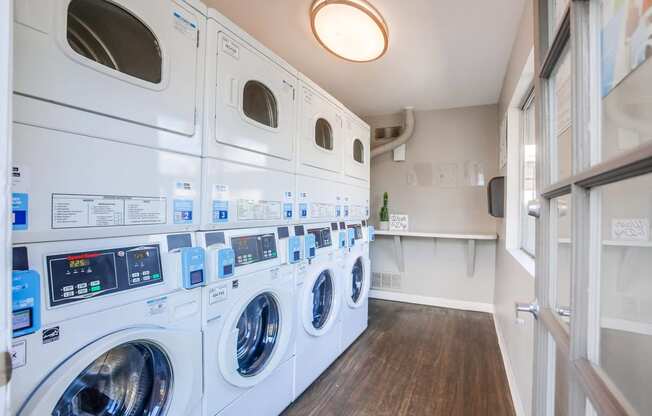 a washer and dryer in a laundry room with a counter