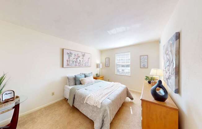 a bedroom with a window and walk-in closet