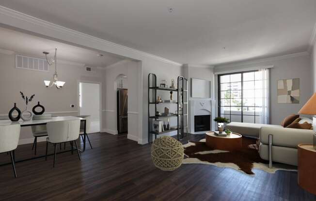 the living room and dining room of an apartment