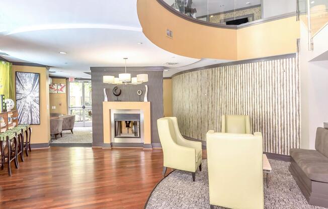 a living room filled with furniture and a fireplace