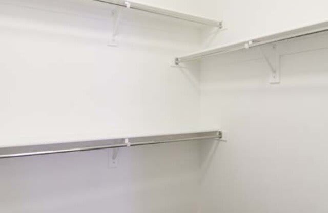 Walk-In Closets With Built-In Shelving at Parc West Apartments, Draper, Utah