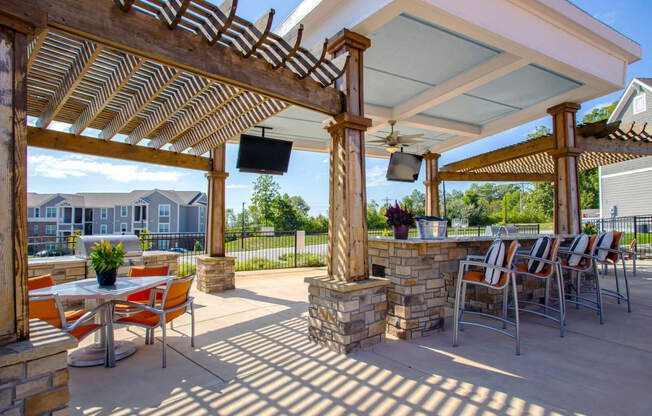 Outdoor TVs, Grilling Station And Entertainment Space at River Crossing Apartments, St. Charles, 63303