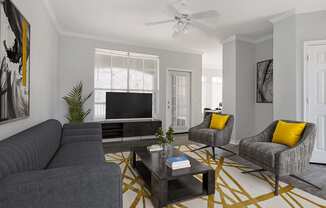 a living room with gray walls and a yellow and gray rug