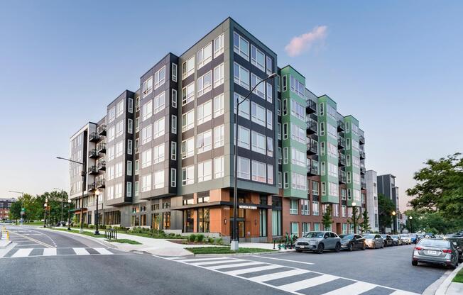 Street-level view of our community along the H Street Corridor, featuring bold architecture, street-facing retail, and an active setting.
