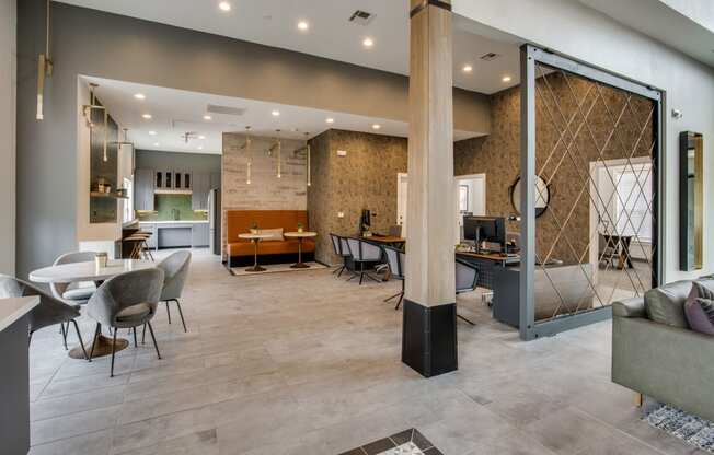 the lobby with tables and chairs at Carrington at Barker Cypress, Cypress, TX, 77433