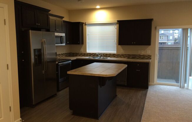 Stylish 3-Bedroom Bethany Residence with Open-Concept Living, Fenced Yard, and Attached Garage