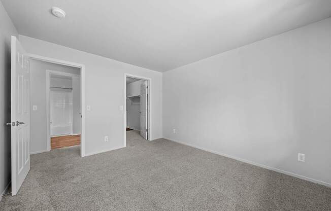 Spacious bedroom with ample storage space at Woodland Villa Apartments in Westland, MI.