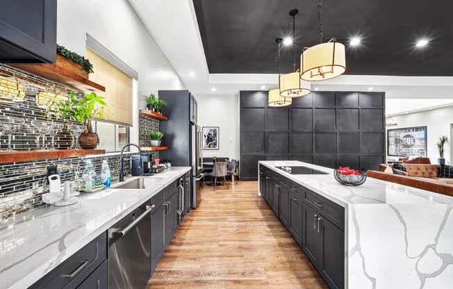 clubhouse kitchen with dark cabinetry and white countertops