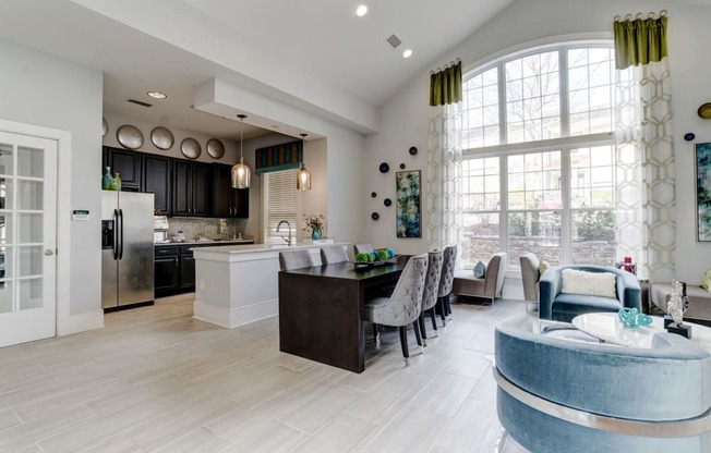 a kitchen and living room with a large window