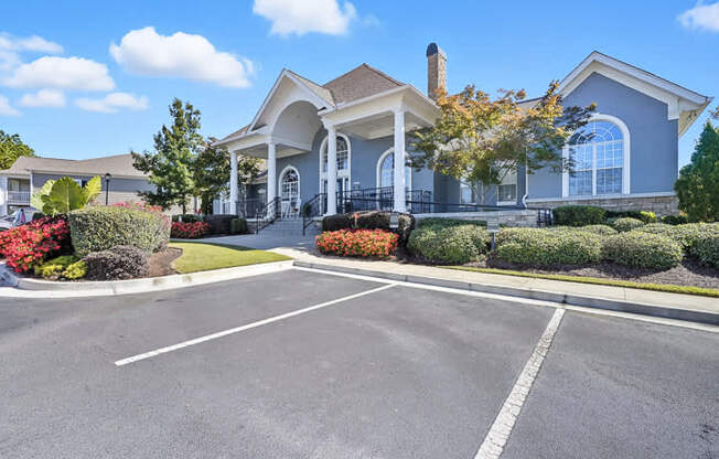 A large house with a driveway in front of it.