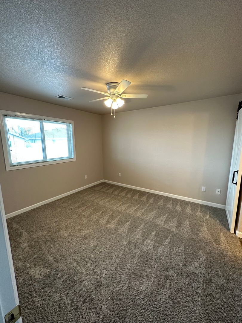2 BEDROOM, PLUS OFFICE SPACE, 2 BATHROOM, SINGLE LEVEL TOWNHOME WITH 2 CAR ATTACHED GARAGE