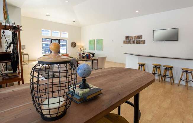 A room with a wooden table and a globe on it.