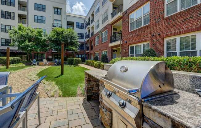 Outdoor grilling area at Berkshire Ninth Street apartments Durham