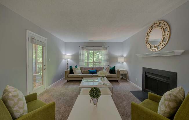 A living room with a fireplace and a mirror on the wall.
