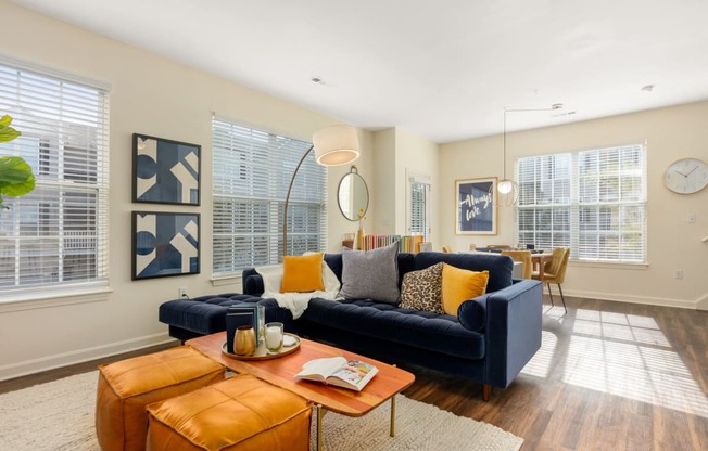 a living room with a couch and a coffee table at Residences at Stevens Pond, MA 01906