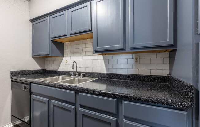 Whitney Manor Apartments in Gretna, LA photo of kitchen with subway tile backsplash