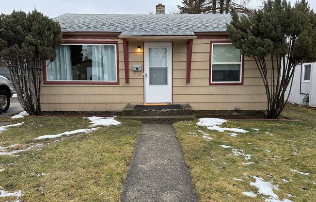 Cozy and Conveniently Located 2 Bed 1 Bath Spokane Home w/ Detached Garage & Heated Multipurpose Room!