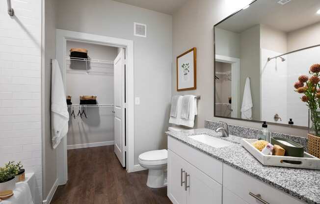 our apartments offer a bathroom with a shower at 55 Fifty at Northwest Crossing, Houston