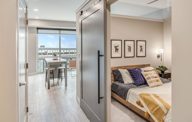 The Asher apartments bedroom with barn door