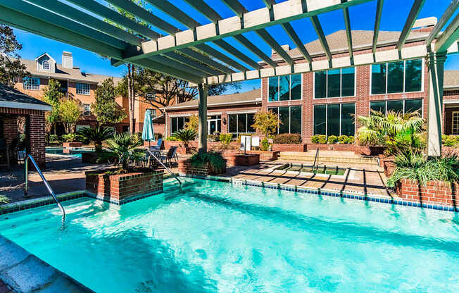 A swimming pool under a covered patio area.
