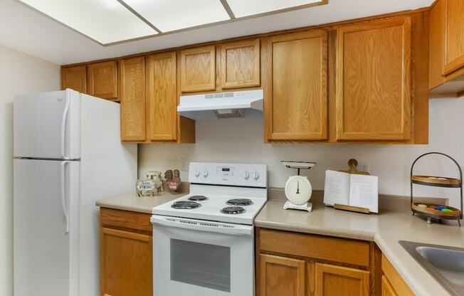 Kitchen with White Appliances at Aztec Springs