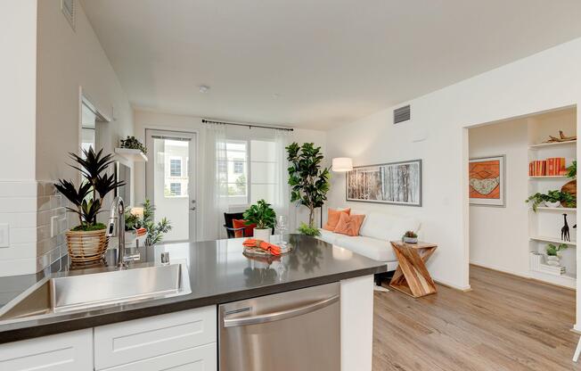 a living room filled with furniture and vase of flowers on a table