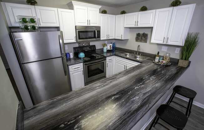 a kitchen with stainless steel appliances and a counter top