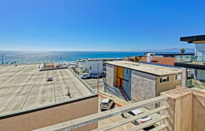 MODERN, BRIGHT & SPACIOUS, TRI-LEVEL DETACHED TOWNHOUSE W/ UNOBSTRUCTED OCEAN VIEWS, 2 BALCONIES & 4-CAR PARKING CLOSE TO RESTAURANTS, SHOPPING, EASY FREEWAY ACCESS & JUST 2 BLOCKS TO BEACH!
