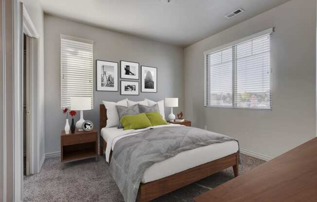 a bedroom with a bed and two nightstands and a window