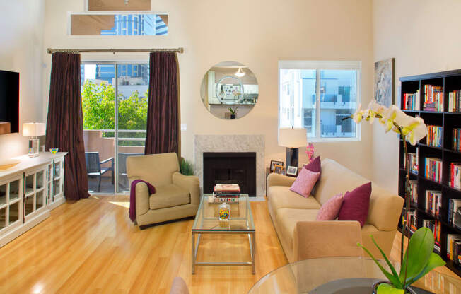 Apartment living room with fireplace and private balcony