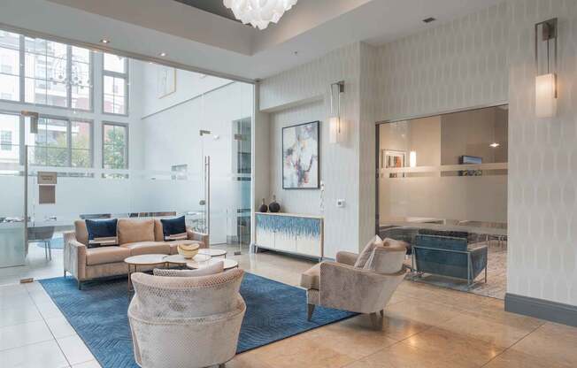 A spacious living room with a large sofa set and a television at Harbor Pointe Apartments, New Jersey