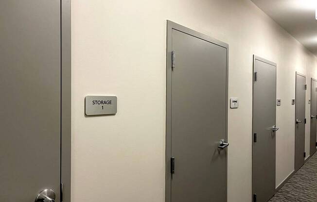 A row of doors with a sign that says "Storage" on the wall.