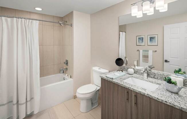 A modern bathroom with a white shower curtain and a white toilet. at Palma, Doral, Florida