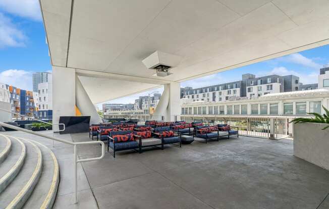 Covered patio and outdoor movie theater at One Santa Fe apartments