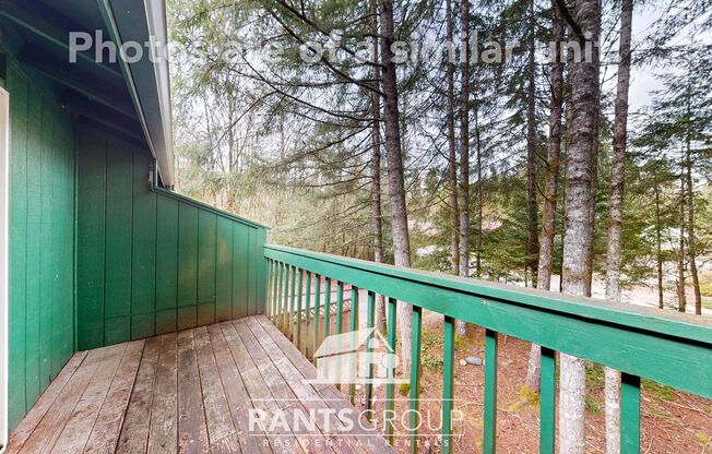 Lovely, wooded 2-bedroom apartment with a large private deck and in-unit washer & dryer!