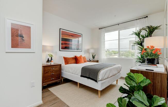 a living room filled with furniture and a large window