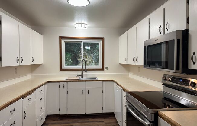 Cozy one story home on beautiful close to town acreage.