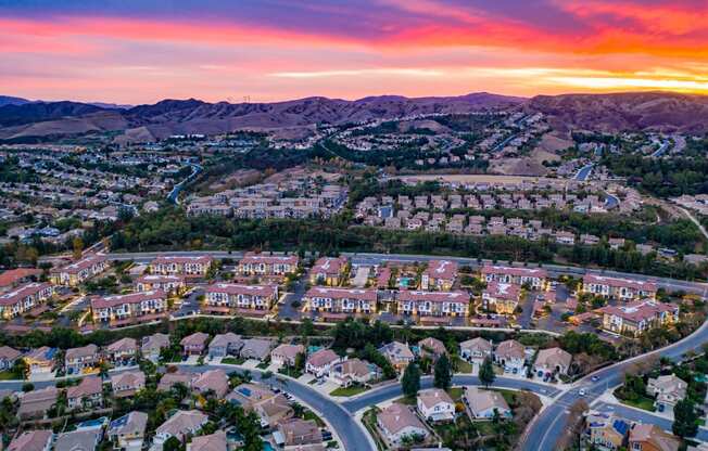 aerial view of capriana apartments and chino hill neighborhood at sunset at Capriana at Chino Hills, Chino Hills