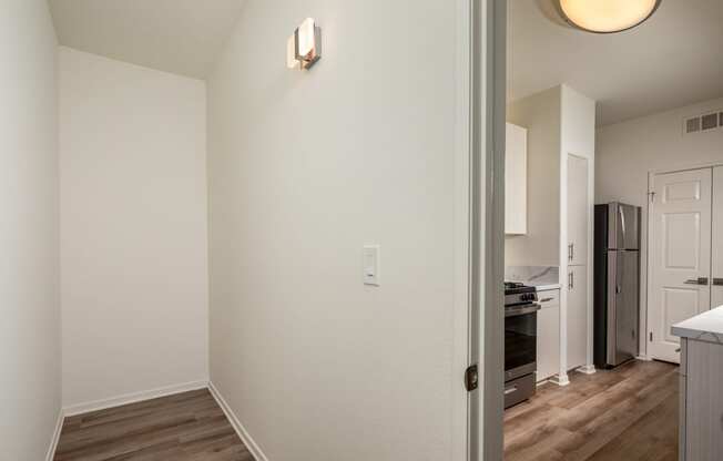 a view of a kitchen and living room from a doorway