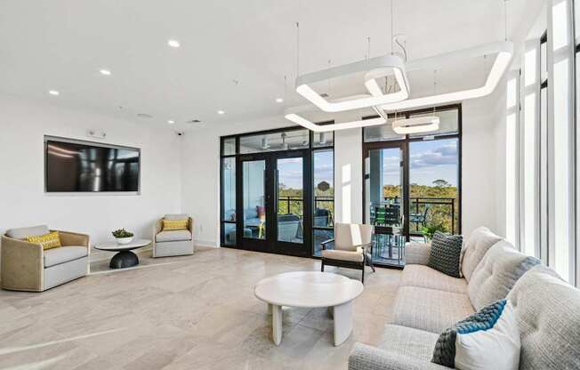 a living room with a couch and a coffee table at Link Apartments® Calyx, North Carolina, 27517