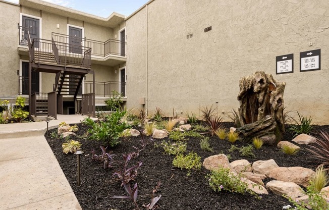 a garden in front of a building