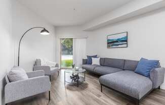 a living room with a couch and two chairs  at Shoreline Village, Washington